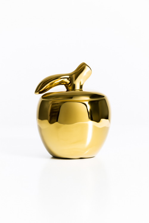 Bougie en forme de pomme dorée